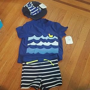 Baby Gap swim trunks- rashguard and matching hat.